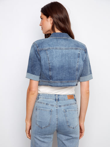 Stay fashionable in this versatile denim jacket, designed with short length and rolled sleeves for a contemporary touch by Charlie B.