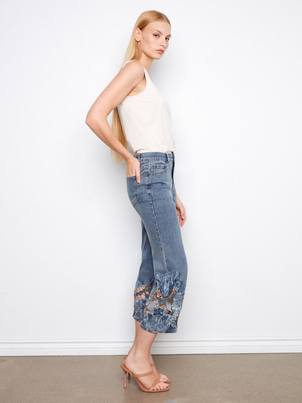 Lace hem detail on these jeans provides an elegant finish, making them perfect for both casual and dressy occasions. By Charlie B.