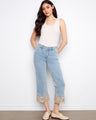 Cropped flare jeans in light blue with a regular rise, showcasing intricate lace hem details for a chic look by Charlie B.