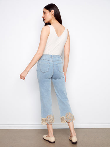 Featuring stretch denim, these light blue cropped jeans offer both comfort and style with delicate lace hems by Charlie B.
