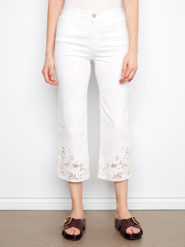 Designed with a regular rise, these white cropped pants offer both fashion and functionality by Charlie B.