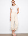 Cropped jeans with a regular rise and floral lace hem, offering a chic flared fit by Charlie B.