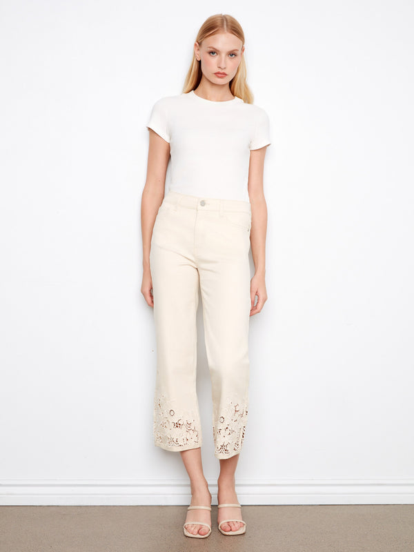 White cropped flare jeans featuring stretch twill fabric and elegant lace detailing by Charlie B.