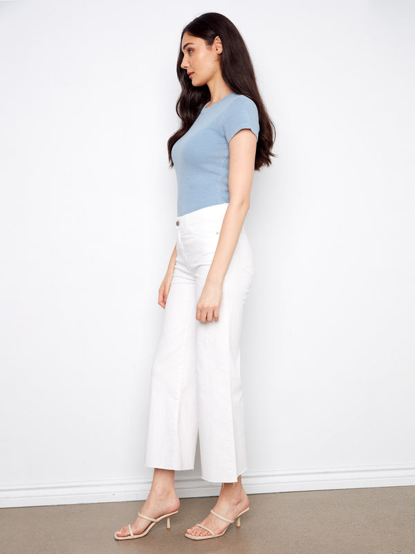 Designed with a raw hem, these pants offer an edgy and contemporary vibe that's effortlessly fashionable. By Charlie B.