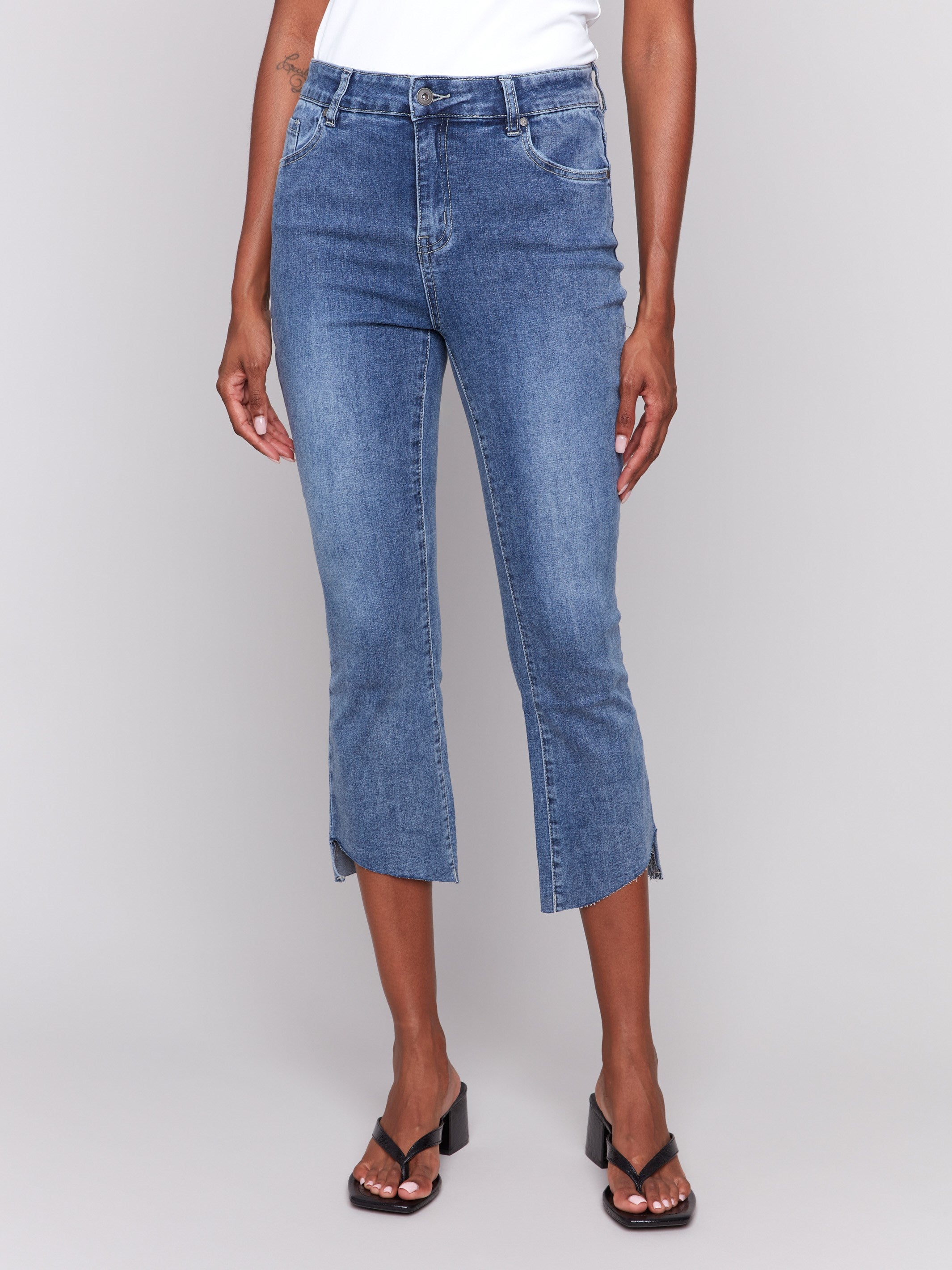 Cropped length jeans in medium blue with a regular rise by Charlie B.