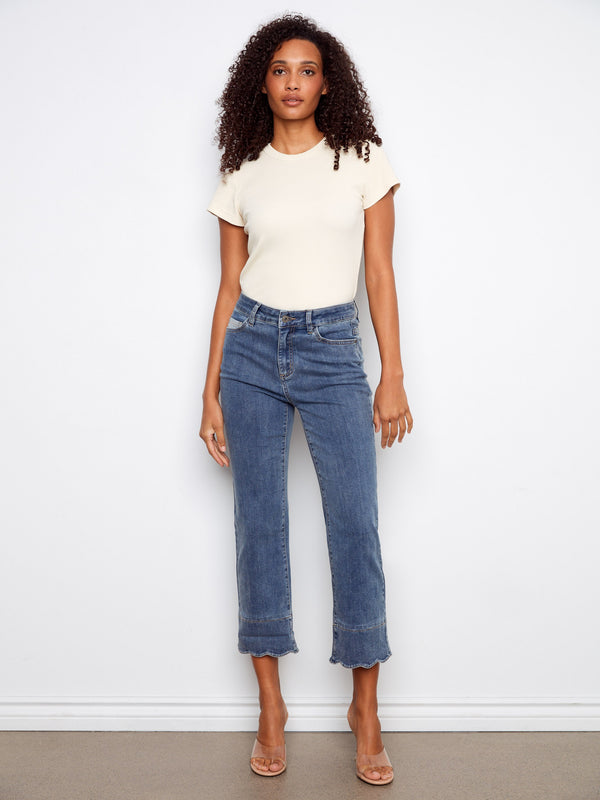 Cropped jeans in medium blue with a straight fit, adorned with a unique contrast scallop cuff and five-pocket style by Charlie B.