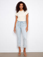 Light blue jeans with a flared leg and frayed details, featuring a regular rise and stretch denim for comfort by Charlie B.