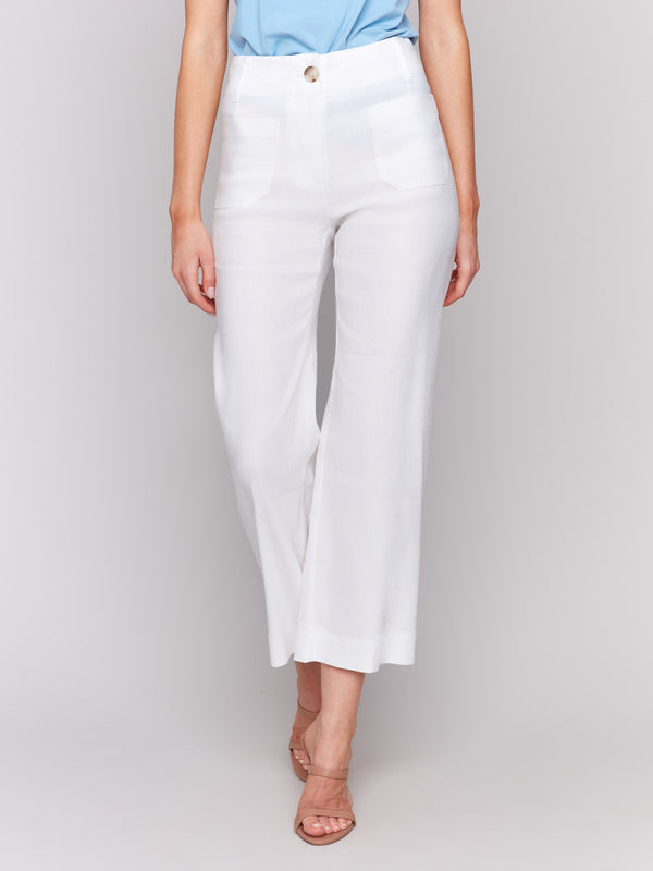 Versatile white pants perfect for summer wear with button details by Charlie B.