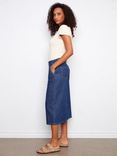 Featuring convenient slash pockets, these denim culottes combine functionality with fashion for a versatile piece by Charlie B.