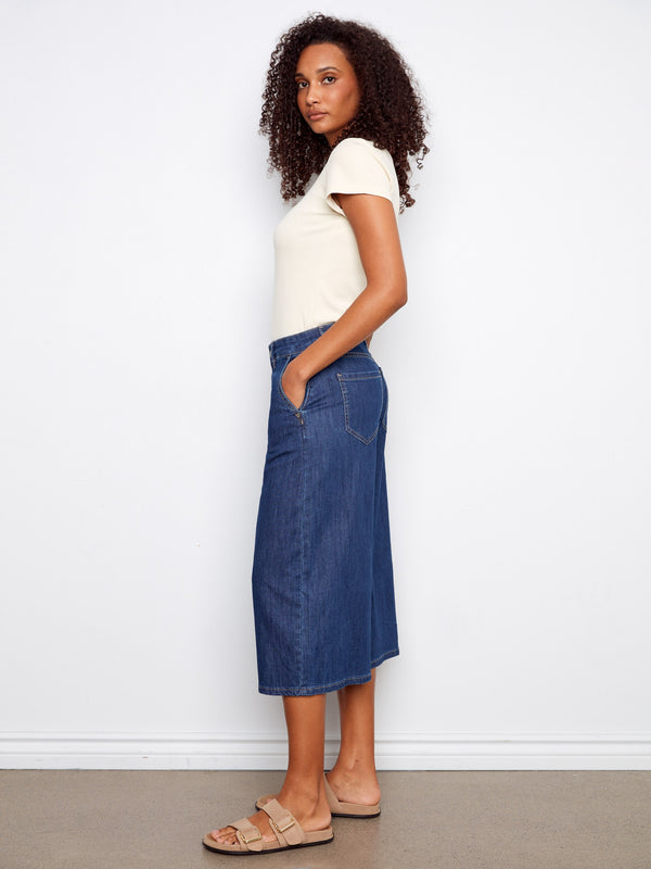 Featuring convenient slash pockets, these denim culottes combine functionality with fashion for a versatile piece by Charlie B.
