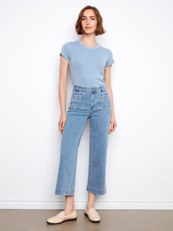 Denim jeans with a stylish flare fit, featuring front patch pockets for added detail. Made from stretch fabric by Charlie B.