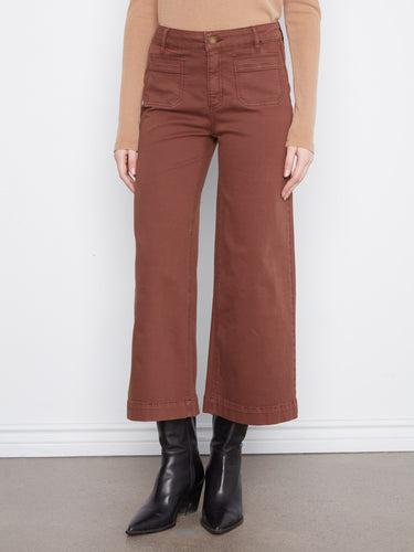 The cropped length of these pants adds a modern touch, perfect for showcasing your favorite footwear. Made with care by Charlie B.