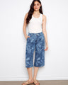 Denim palazzo jeans with a floral pattern, featuring slash pockets for a touch of practicality by Charlie B.
