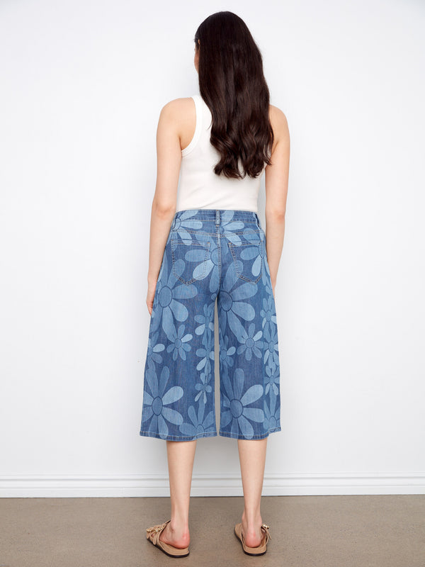 Cropped denim palazzo pants with wide-leg fit and eye-catching floral print, designed for comfort by Charlie B.