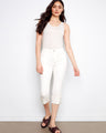 White cropped jeans in stretch twill fabric with a slim fit and snap button cuffs, featuring a regular rise by Charlie B.