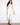 White cropped jeans in stretch twill fabric with a slim fit and snap button cuffs, featuring a regular rise by Charlie B.