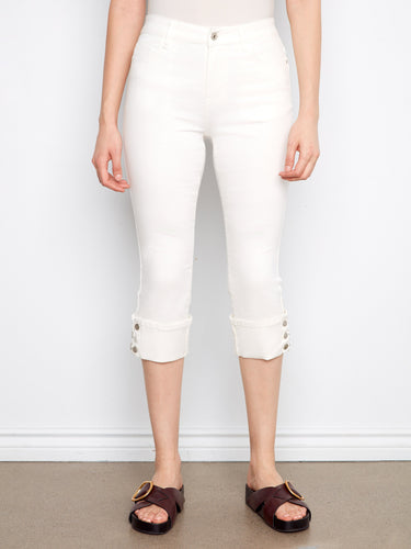 Cropped white jeans with five-pocket design, narrow fit and stylish snap button detail at the cuff by Charlie B.