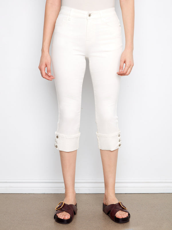 Cropped white jeans with five-pocket design, narrow fit and stylish snap button detail at the cuff by Charlie B.