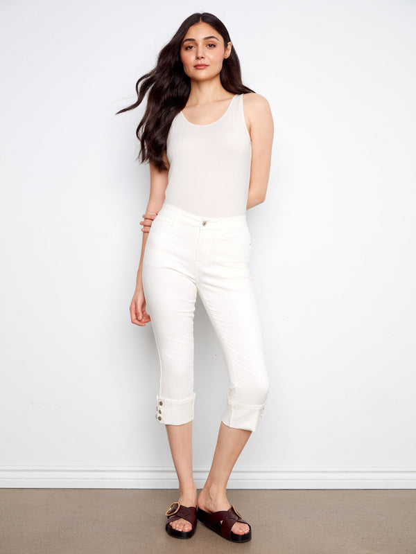 Stretch twill fabric in these white cropped jeans provides comfort and style, enhanced by snap button cuffs by Charlie B.