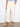 Showcasing cropped length twill pants paired with a light blue top, perfect for casual outings. Designed by Charlie B.