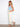 Utility style pockets enhance these natural twill pants, paired with a light blue top for effortless style. Crafted by Charlie B.