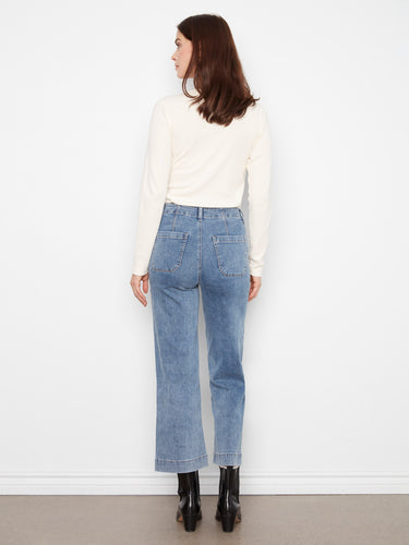 Blue cropped jeans designed with a regular rise and rectangular patch pockets by Charlie B.