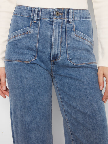 Wide-leg blue cropped denim pants with comfortable stretch fabric and stylish design by Charlie B.
