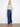 Jeans with rectangular patch pockets adding a touch of utility to the design by Charlie B.