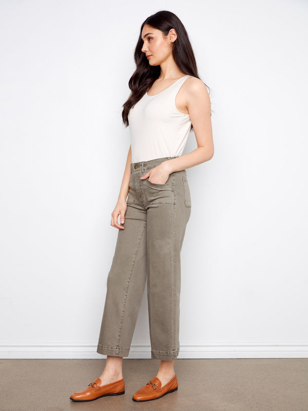 The rectangular patch pockets add both function and flair to these versatile pants, ensuring practicality meets fashion by Charlie B.