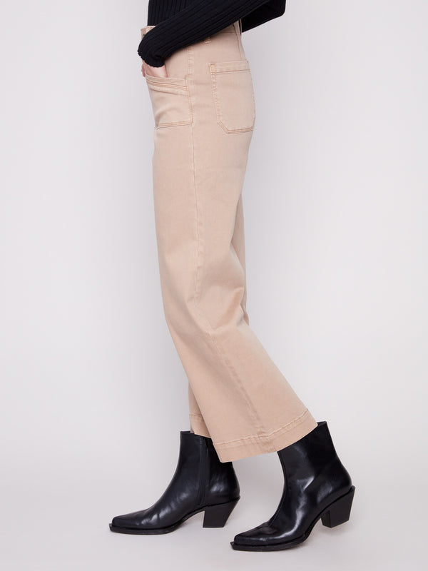 These pants showcase rectangular front patch pockets, adding practical flair to the design by Charlie B.