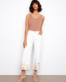 These white jeans feature a regular rise and floral embroidery, adding elegance to any look by Charlie B.