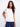 Elegant white top with a crew neckline, featuring beautiful embroidery on the shoulder for a stylish touch. Crafted by Charlie B.