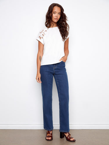This chic cotton top showcases cuffed short sleeves, adding a modern flair to your casual wardrobe. Designed by Charlie B.