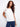 Classic white top featuring cuffed short sleeves and crafted from soft cotton fabric for ultimate comfort. By Charlie B.