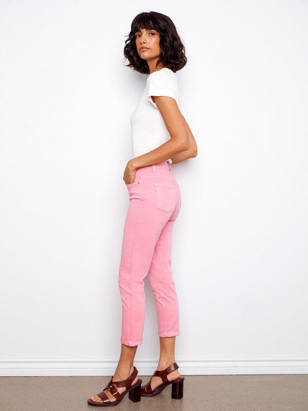 Featuring a five-pocket design, these pink cropped pants provide both functionality and fashion-forward style. By Charlie B.