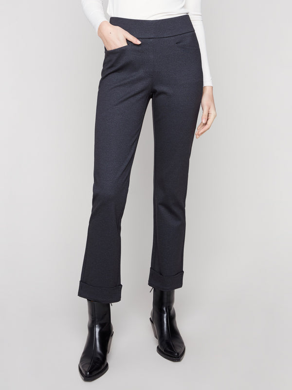 These navy ponte pants offer ankle-length style with welt pockets for added functionality by Charlie B.