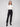 Black ponte pants featuring a straight leg design and cuffed hems, crafted for style and comfort by Charlie B.