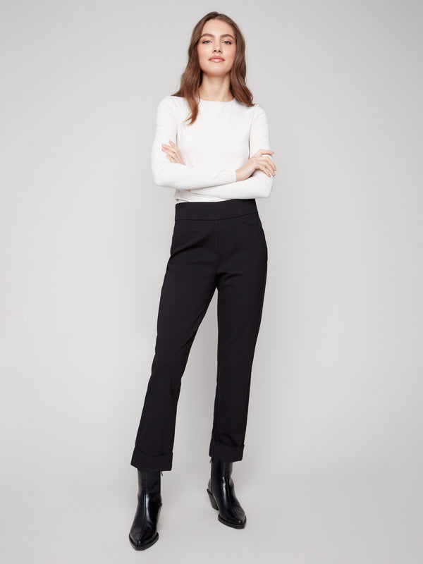 Black ponte pants featuring a straight leg design and cuffed hems, crafted for style and comfort by Charlie B.