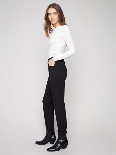 Crafted from stretch fabric, these black pants offer a mid-rise waist for a flattering fit by Charlie B.