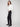 Crafted from stretch fabric, these black pants offer a mid-rise waist for a flattering fit by Charlie B.