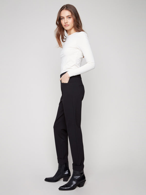 Crafted from stretch fabric, these black pants offer a mid-rise waist for a flattering fit by Charlie B.
