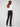 Designed with rolled cuffs and sleek welt pockets, these black pants are perfect for any occasion by Charlie B.