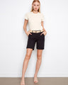 Black shorts with a stylish cuffed hem, paired with a neutral top and sandals. The look is casual yet chic by Charlie B.