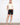 Black shorts with a stylish cuffed hem, paired with a neutral top and sandals. The look is casual yet chic by Charlie B.