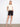 Black shorts with a stylish cuffed hem, paired with a neutral top and sandals. The look is casual yet chic by Charlie B.