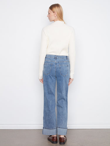 Adorned with decorative patches and studs, these jeans add flair to your wardrobe essentials by Charlie B.