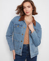 Denim jacket featuring a stylish corduroy collar, perfect for adding a touch of texture to your outfit. By Charlie B.