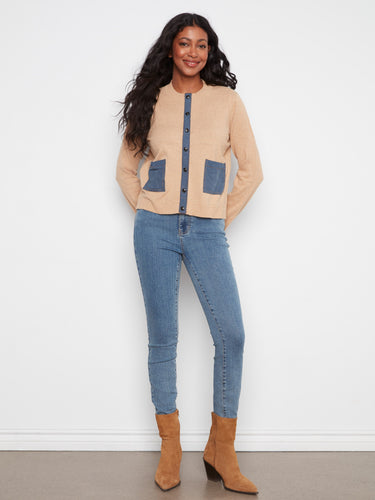 Chic cardigan with denim patch pockets adds a trendy touch to any ensemble. Crafted from high-quality cotton by Charlie B.