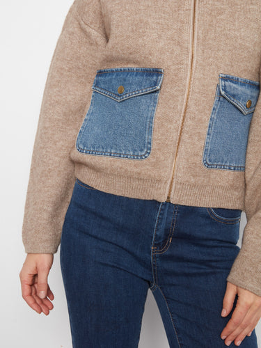 Stylish heather sand sweater showcasing unique denim patch pockets and cozy long sleeves for added warmth by Charlie B.