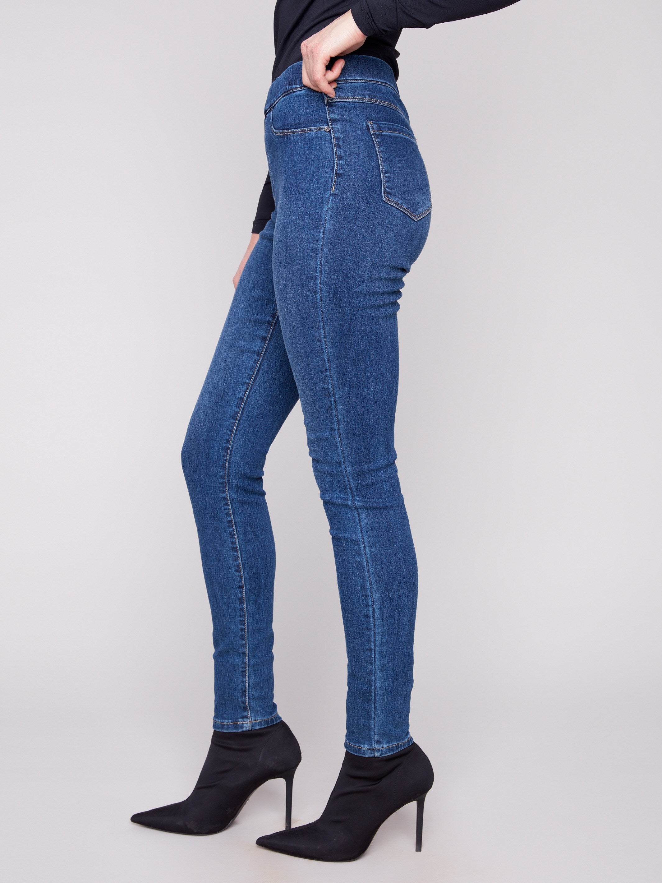 Stylish indigo jeans with two front mock pockets and back patch pockets for added detail by Charlie B.